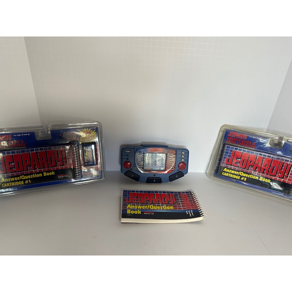Tiger Electronics Jeopardy Handheld LCD Game Console W 3 Cartridges And Booklet